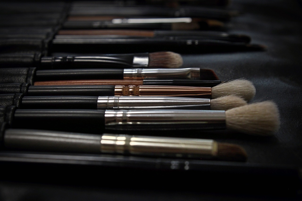 makeup brushes in a line - 2023 makeup trends concept